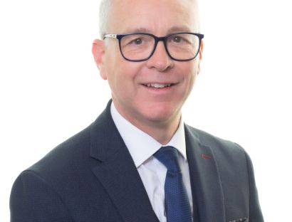 Headshot photo of Dr Christopher Mansell