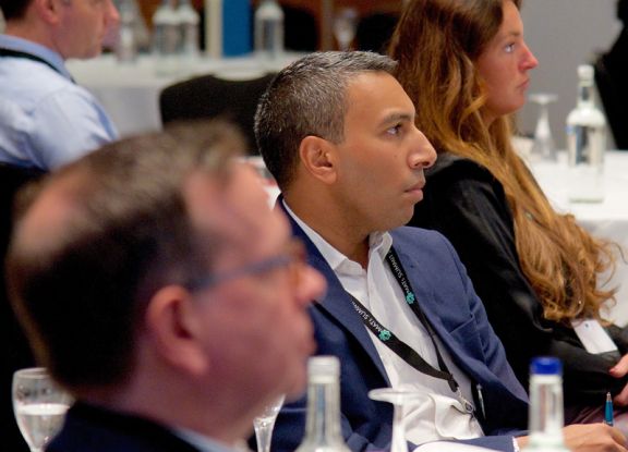 Delegates having a discussion at a conference