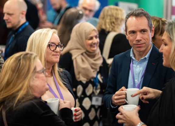 Delegates having a discussion at a conference