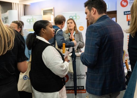 Delegates having a discussion at a conference