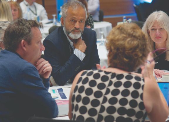 Delegates sitting at a table